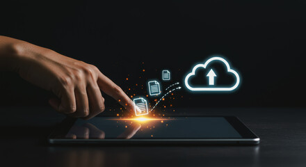 A hand interacts with a digital tablet, symbolizing cloud data storage, representing the intersection of technology and accessibility.