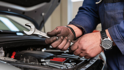 mechanic changing car engine