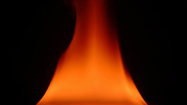 Swirling turbulent fire flame with smoke vortices on a black background. Combustion transitions to a smooth laminar flow. Abstract element of heat and energy