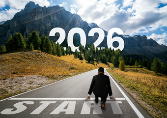 2026 New Year journey and future vision concept . Businessman traveling on highway road leading...