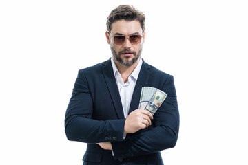 Man in suit holding cash money in dollar banknotes on isolated white background. Studio portrait of...