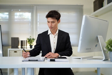 Naklejka premium Busy financial specialist man working with finance sales document report and pc laptop computer in office. Mature executive businessman professional check analysing business, invest review