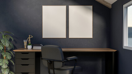 Blank frames on dark wall over wooden drawer table and swivel arm chair aside window in study room.