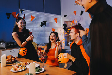Joyful office Halloween party with coworkers in costumes, celebrating with drinks and laughter, fostering teamwork and festive spirit