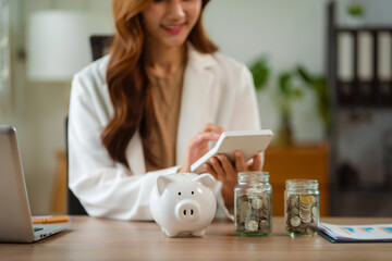 Business women using calculator with computer laptop, Business accounting, budget and loan paper in office.