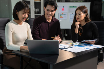 Businessmen team or financial data analysts working with tablets and laptop computers and data graphs together. Plan to analyzing projects in the office.