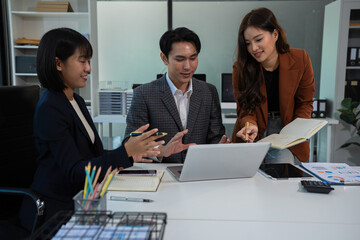 Businessmen team or financial data analysts working with tablets and laptop computers and data...