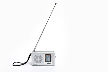 Portable battery-powered AM/FM radio photographed against a white background.