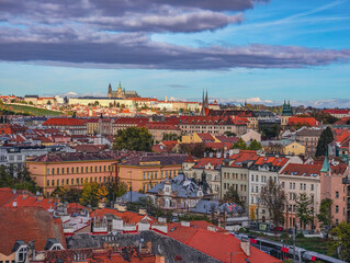 Obraz premium Prague Cityscape Panorama Red Tile Rooftops Famous Castle Skyline Historic Architecture Czech Republic Travel Destination European City Aerial View