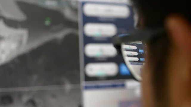 Scientist analyzing a sample under an electron microscope in a laboratory. Represents microscopic analysis, scientific research, material science, and advanced laboratory technology.
