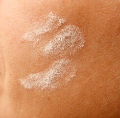 Flour on human skin as a background. Close-up.
