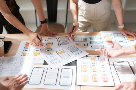 Product designers collaborating on mobile app ui ux wireframes