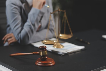 Law theme, mallet of the judge, law enforcement officers, evidence-based cases and documents taken...