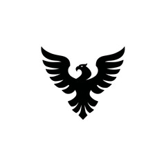 Obraz premium Bold black eagle or phoenix bird icon with majestic spread wings, a powerful vector graphic symbolizing strength, freedom, ambition, and success.
