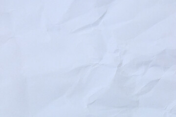 A dramatic collection of crumpled paper sheets in monochrome, highlighting the stark interplay of deep shadows, bright highlights, and intricate abstract textures.