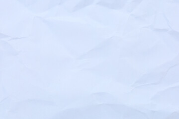 A dramatic collection of crumpled paper sheets in monochrome, highlighting the stark interplay of deep shadows, bright highlights, and intricate abstract textures.