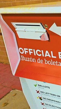 Vertical official ballot drop box, clearly marked in English and Spanish as &ldquo;Official Ballot Drop Box, Buz&oacute;n de Boleta Oficial,&rdquo; stands outdoors as a secure location for submitting election ballots.