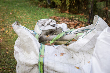  Asbestos Pipes and Roofing Waste in Construction Bag. Hazardous material and environmental safety