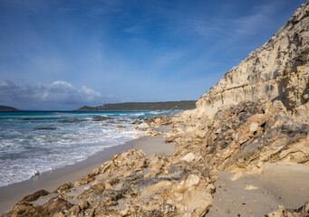 The rocky limestone shore of Observatory beach, looking towards Observatory Island and point,...