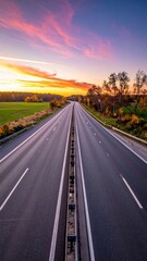 Fototapeta premium Empty countryside highway extending toward the horizon under a vast sky, a long summer journey through a rural landscape