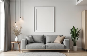 Modern living room interior with grey sofa and empty white frame on wall. Minimal decor includes plant, side table, hanging lamps. Cozy space for art display or home staging.