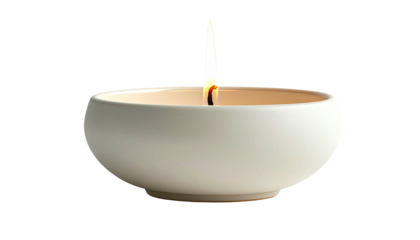 Candle flame burning in small round, white ceramic bowl
