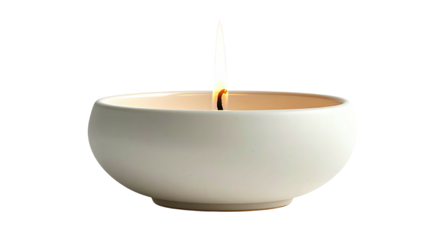 Candle flame burning in small round, white ceramic bowl