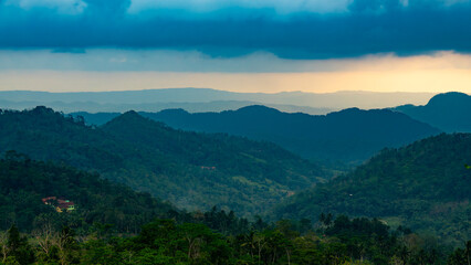 Obraz premium sunrise in the mountains, tropical forest, Cilacap, Indonesia