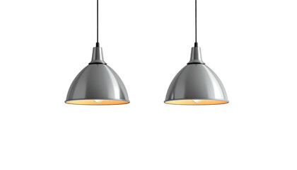 Twin silver pendant lights brightly illuminate on a black background