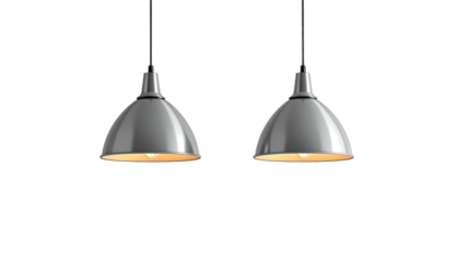 Twin silver pendant lights brightly illuminate on a black background