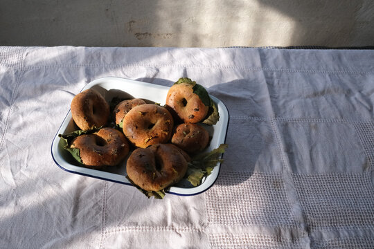 Traditional Ring Pastries with Leaves on Enamel Tray