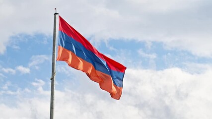 Armenian flag with red and orange stripes is flying in the sky. The flag is from the country of Armenia - Powered by Adobe