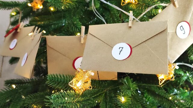 Preparing an Advent calendar for Christmas. Eco-craft envelopes with numbers for children. Christmas background, Advent from small craft envelopes.