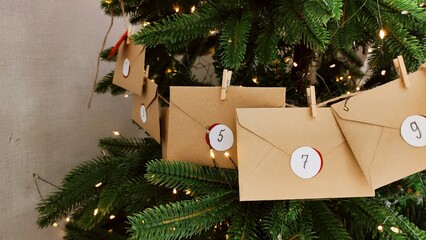 Preparing an Advent calendar for Christmas. Eco-craft envelopes with numbers for children. Christmas background, Advent from small craft envelopes.