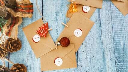 Preparing an Advent calendar for Christmas. Eco-craft envelopes with numbers for children. Christmas background, Advent from small craft envelopes.