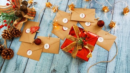 Preparing an Advent calendar for Christmas. Eco-craft envelopes with numbers for children. Christmas background, Advent from small craft envelopes.
