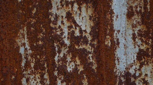 Heavily Rusted Corrugated Metal Sheet with Vertical Rust Streaks and Corrosion Patterns