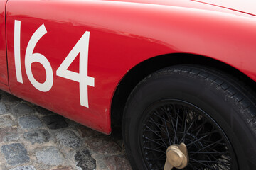 red car race detail number on side door sports racing vintage british car race from sixties fifties
