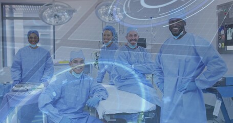 Standing surgical team wearing blue gowns examining operating table in hospital, with AR overlay