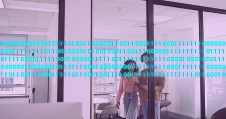 Walking two coworkers in business casual using tablet near glass with cyan binary overlay in office
