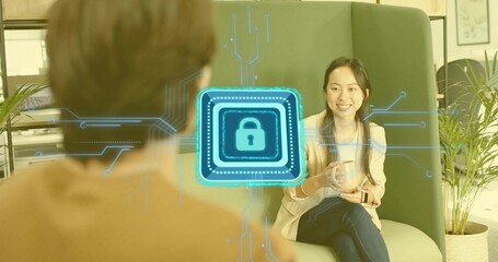 Talking woman in beige blazer holding coffee mug in office lounge, digital lock overlay, copy space