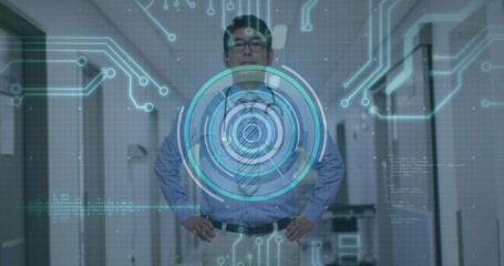 Businessman in shirt and tie standing with hands on hips in lit office corridor, circuit HUD