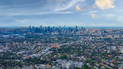 Panorama Sunset  aerial drone view of western Sydney Suburbs of Canterbury Burwood Ashfield Marrickville Campsie with Houses roads and parks in Sydney New South Wales NSW Australia
