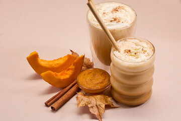 Autumn Pumpkin spice Latte Delight. Pumpkin spice lattes with cinnamon, pumpkin slices, and autumn leaves