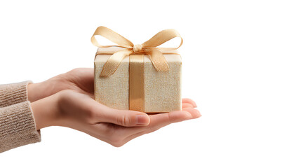 Hands holding a small, beautifully wrapped gift box with a golden ribbon, isolated on transparent background