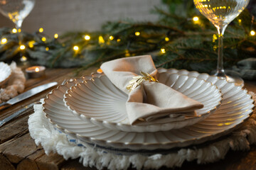 Elegant Christmas table setting. Holiday table arrangement for Christmas dinner.