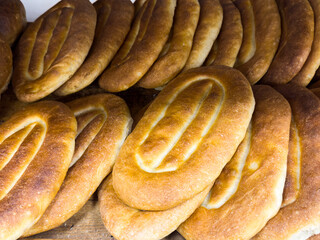 Freshly baked bread on the store counter, Armenian bread Matnakash, crispy loaf of bread, fragrant wheat bread from the oven. High quality
