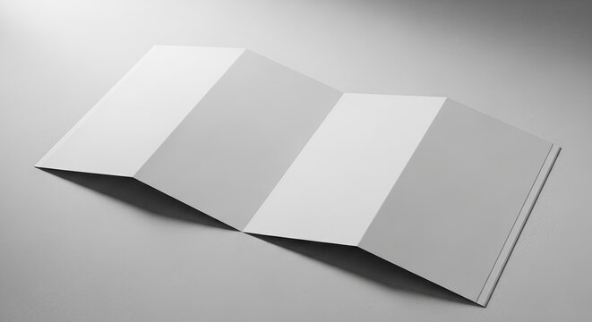 A blank, unfolded white brochure or leaflet with four panels, presented on a light gray background, ready for graphic design and content.jpeg