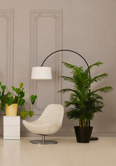 Modern minimalist bedroom interior with duvet cover, a black bed frame, white bedding, stylish armchair, indoor plants, and soft lighting.