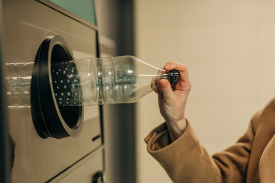 Hand recycling plastic bottle in bottle deposit system collection machine